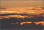 Animation du lever de soleil derrière les nuages (CANON 10D + EF 100/400 L)